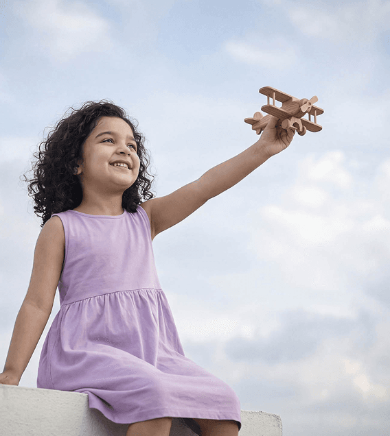 Child with airplane toy